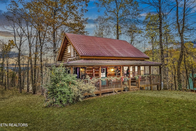 exterior space with a porch and a yard