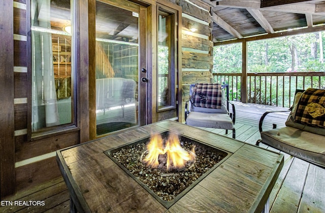 wooden deck with an outdoor fire pit