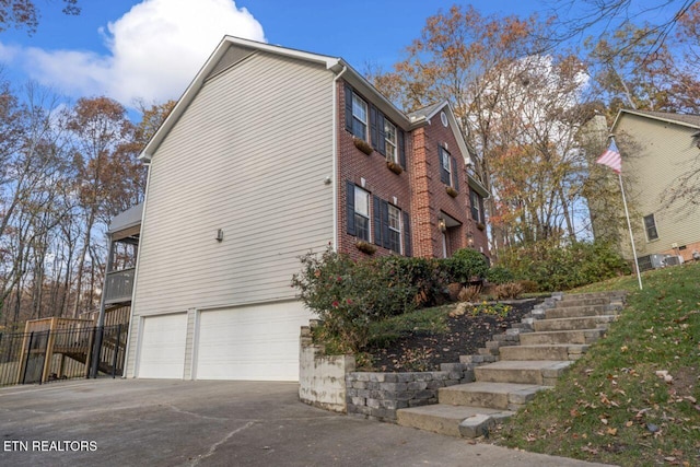 view of side of home with a garage