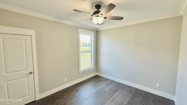 unfurnished room with baseboards, ceiling fan, dark wood finished floors, and crown molding