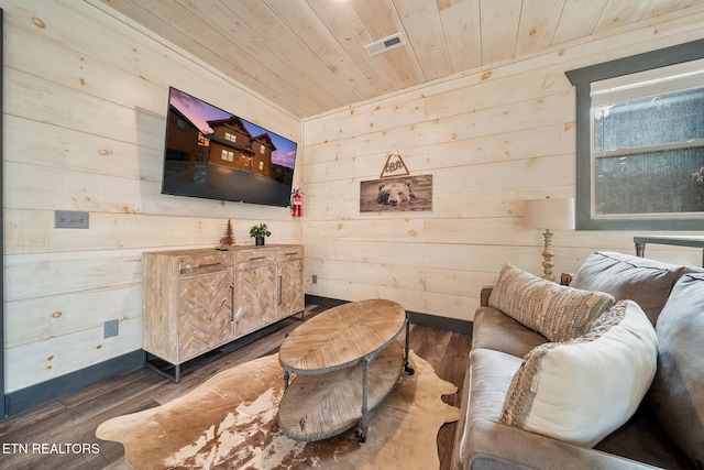 living room with wooden ceiling, dark wood-type flooring, and wooden walls