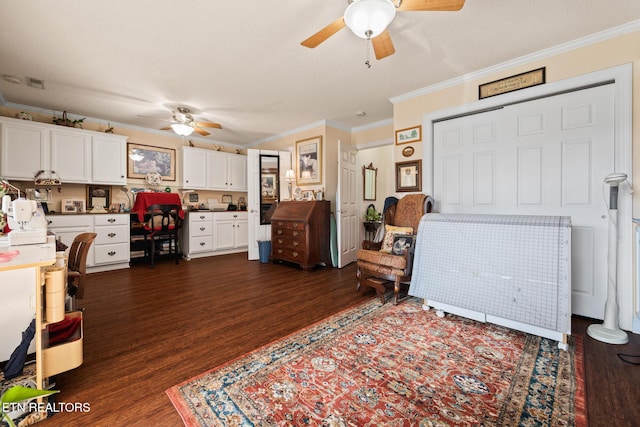 living room with ceiling fan, crown molding, and dark wood-type flooring