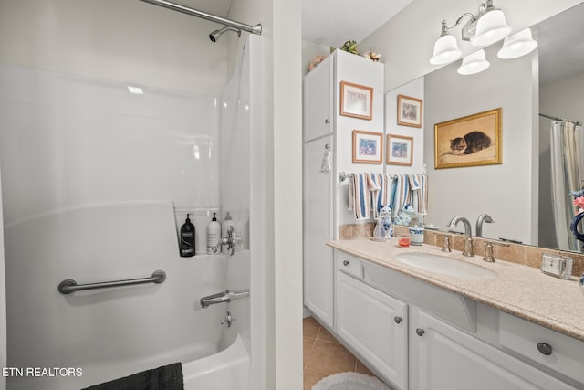 bathroom featuring tile patterned flooring, vanity, and shower / bath combination with curtain