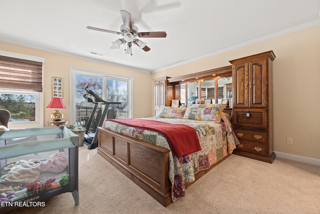 bedroom featuring multiple windows, ceiling fan, light colored carpet, and access to exterior