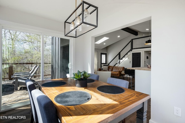 dining space featuring recessed lighting, wood finished floors, vaulted ceiling with beams, and stairs