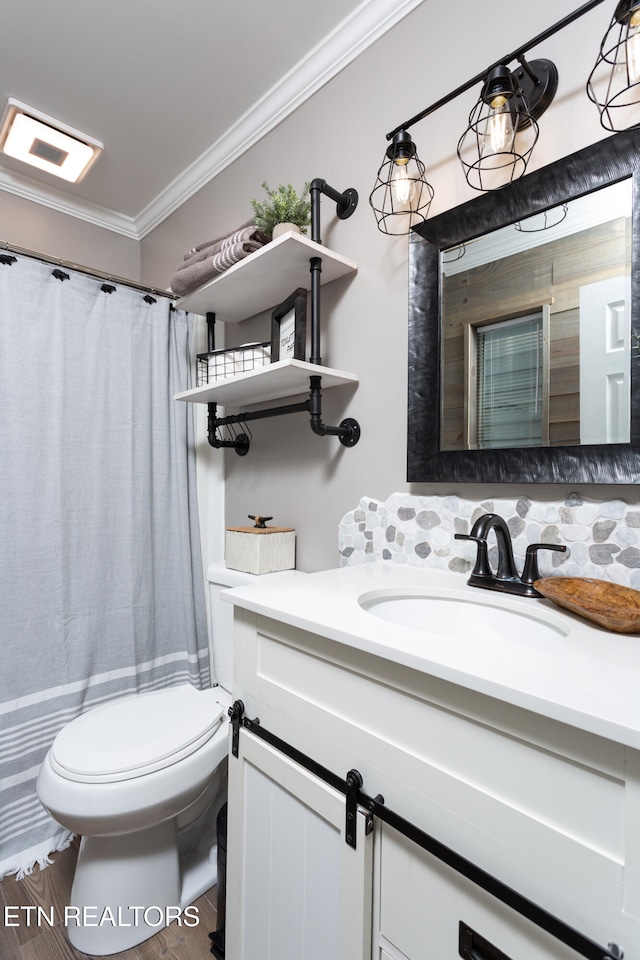 bathroom featuring hardwood / wood-style floors, toilet, decorative backsplash, vanity, and ornamental molding