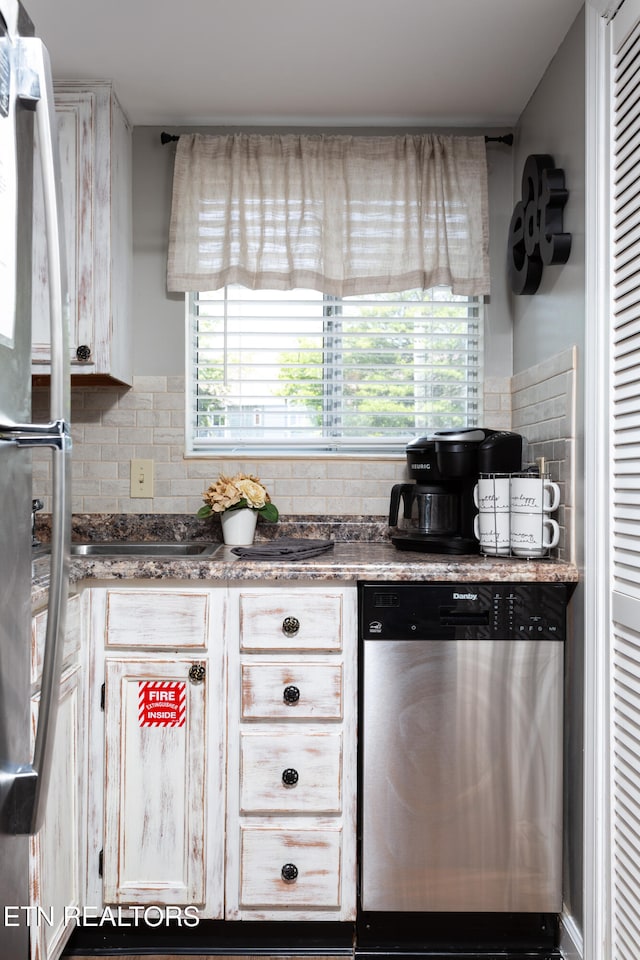 kitchen with dishwasher, a healthy amount of sunlight, and decorative backsplash