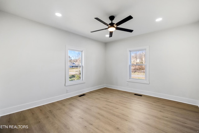 spare room featuring ceiling fan and light hardwood / wood-style floors