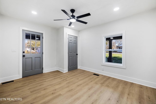 interior space with ceiling fan and light hardwood / wood-style floors