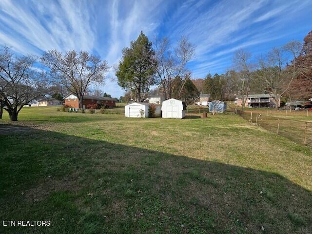 view of yard with a shed and an outdoor structure