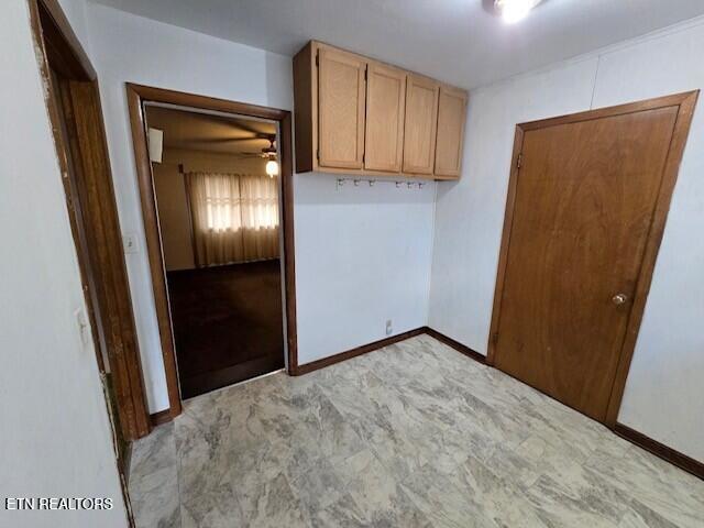 unfurnished bedroom featuring baseboards