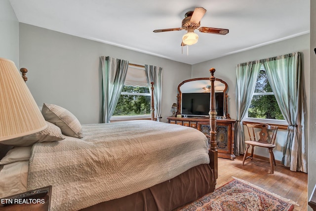 bedroom featuring ceiling fan and light hardwood / wood-style floors