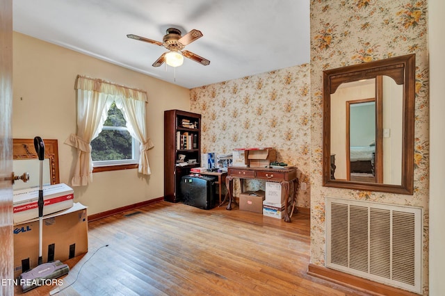 misc room with ceiling fan and light hardwood / wood-style floors