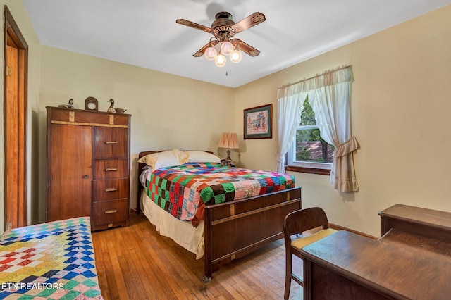 bedroom featuring ceiling fan and hardwood / wood-style floors