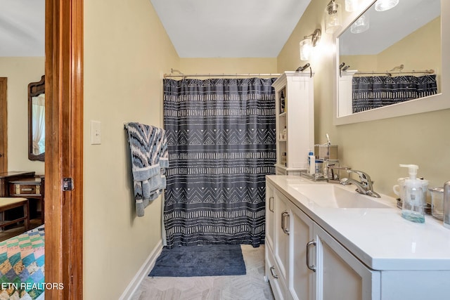 bathroom featuring vanity and walk in shower