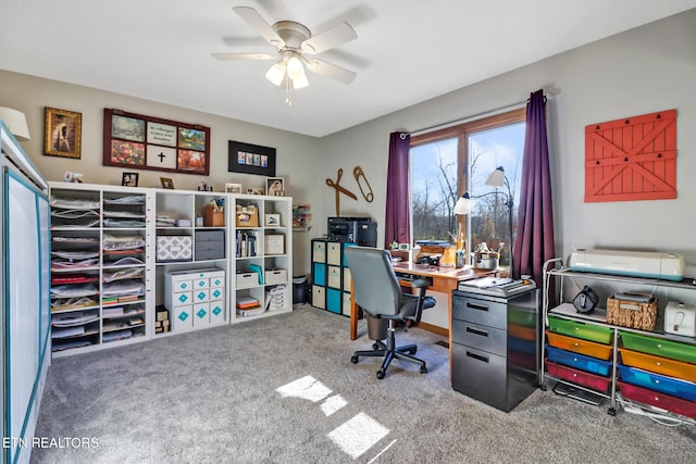 carpeted home office with ceiling fan