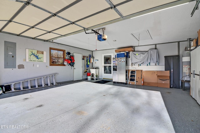 garage featuring gas water heater, stainless steel refrigerator with ice dispenser, electric panel, and a garage door opener