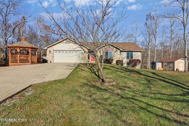 single story home featuring a gazebo, a shed, and a front lawn