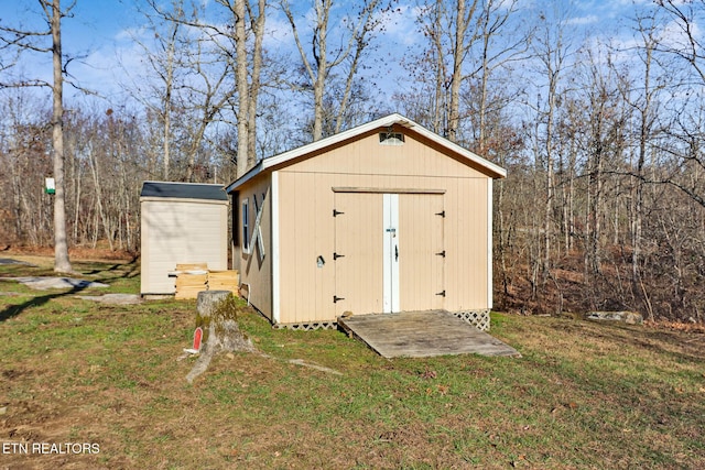 view of outdoor structure with a lawn