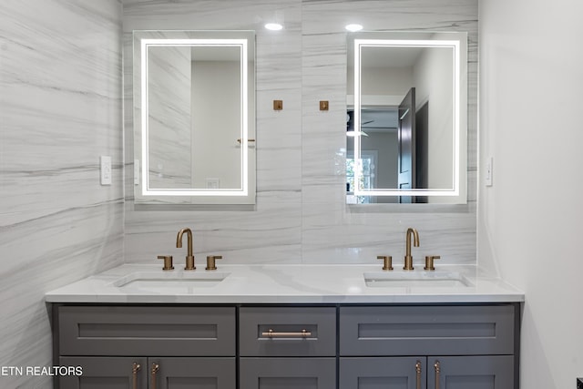 12000 S Fox Den Dr, Knoxville, TN 37934 - bathroom with tile walls, double vanity, and decorative backsplash