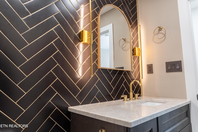 bathroom with vanity and backsplash