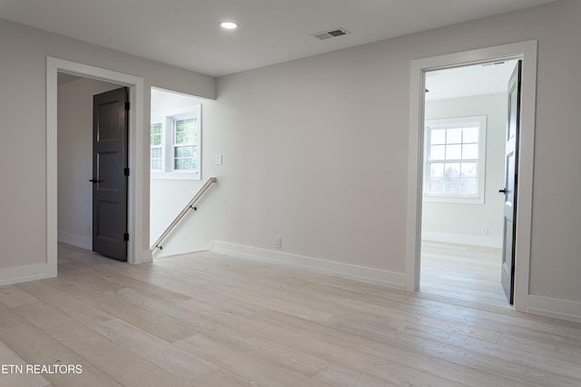 empty room with light wood-type flooring