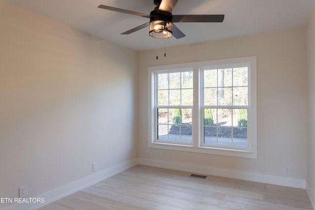 unfurnished room with light hardwood / wood-style flooring and ceiling fan