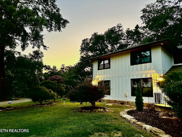 12000 S Fox Den Dr, Knoxville, TN 37934 - back of house at dusk with board and batten siding and a yard
