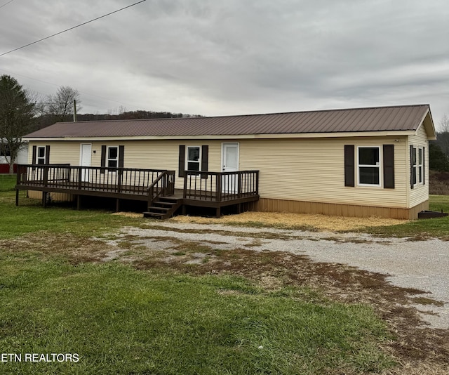 exterior space with a lawn and a deck