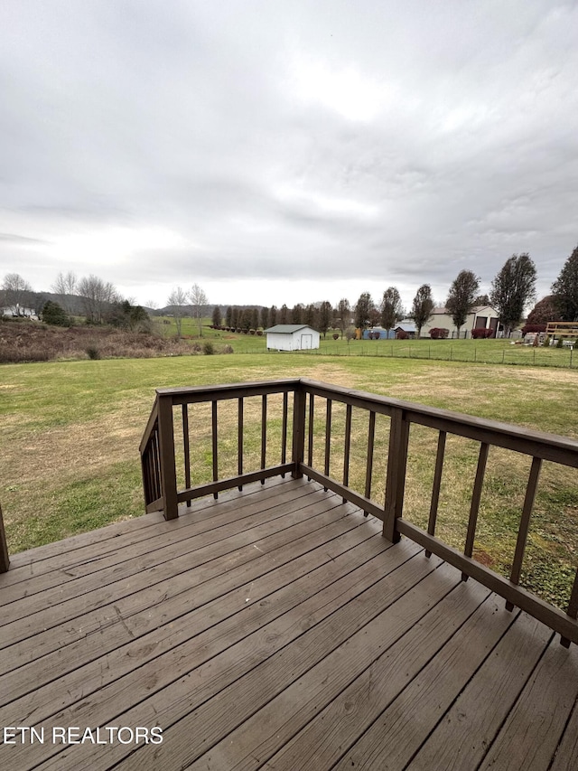 wooden deck with a lawn