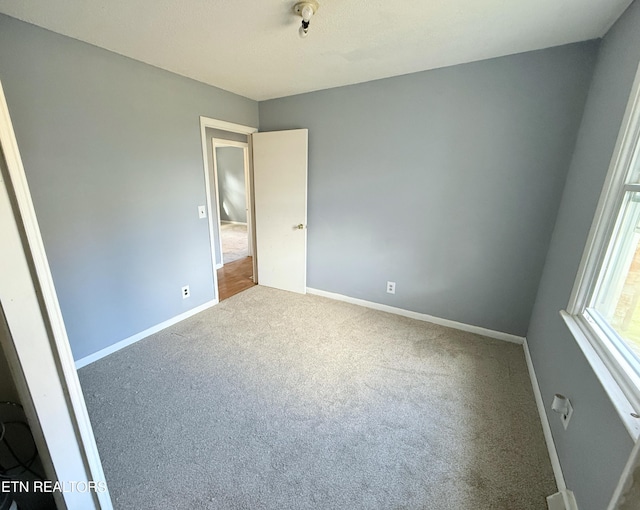 unfurnished bedroom with carpet