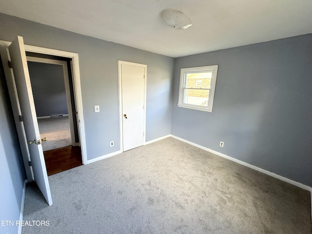 unfurnished bedroom with carpet