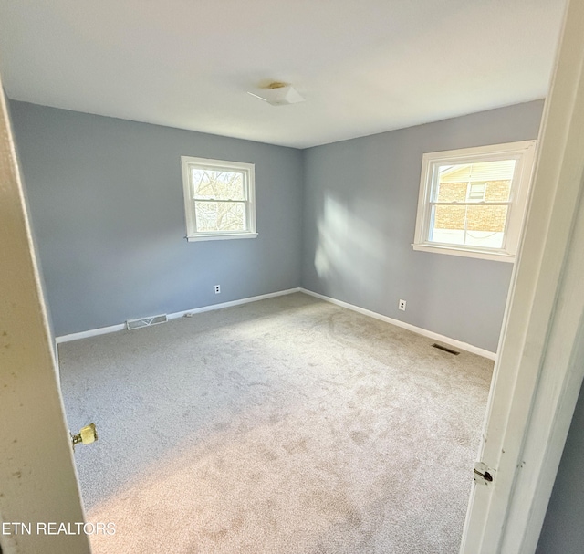 empty room featuring carpet floors