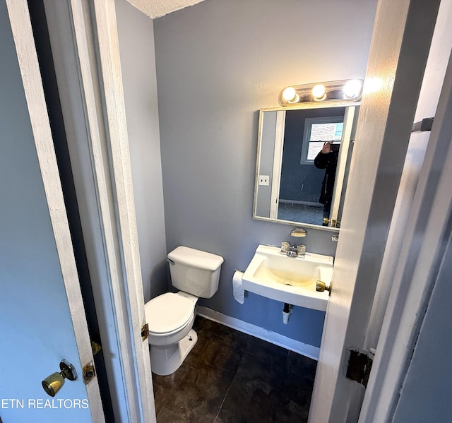 bathroom featuring tile patterned floors, sink, and toilet