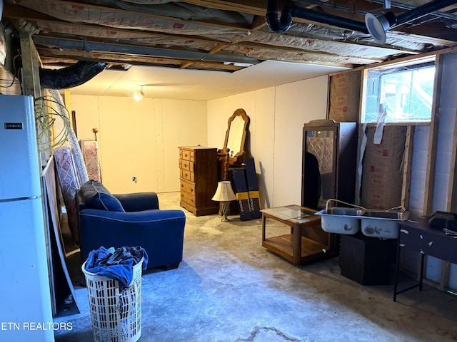 basement featuring white fridge