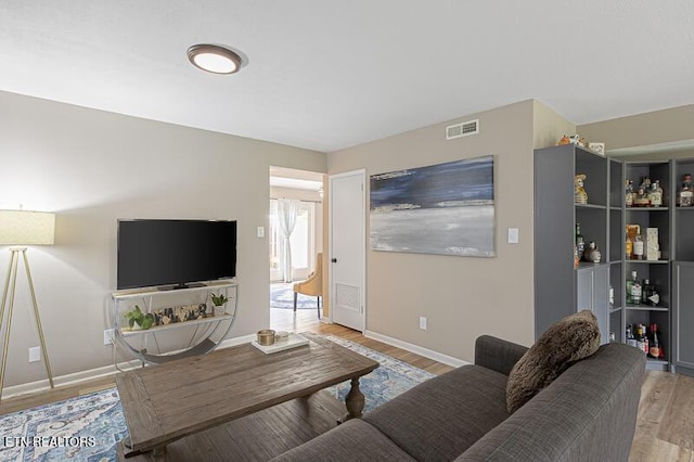 living room with light hardwood / wood-style floors