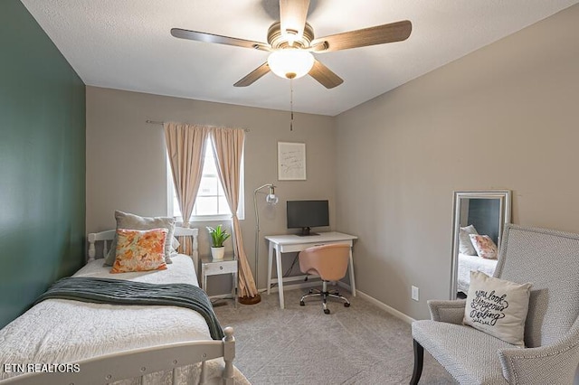 bedroom featuring light colored carpet and ceiling fan