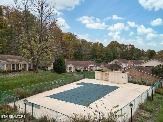 view of swimming pool with a lawn and a patio area