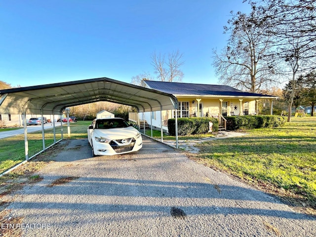 view of parking featuring a carport and a lawn