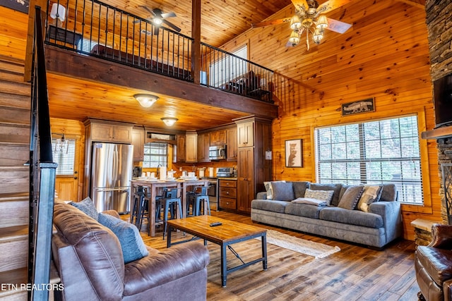 living room featuring ceiling fan, high vaulted ceiling, wooden ceiling, and hardwood / wood-style flooring