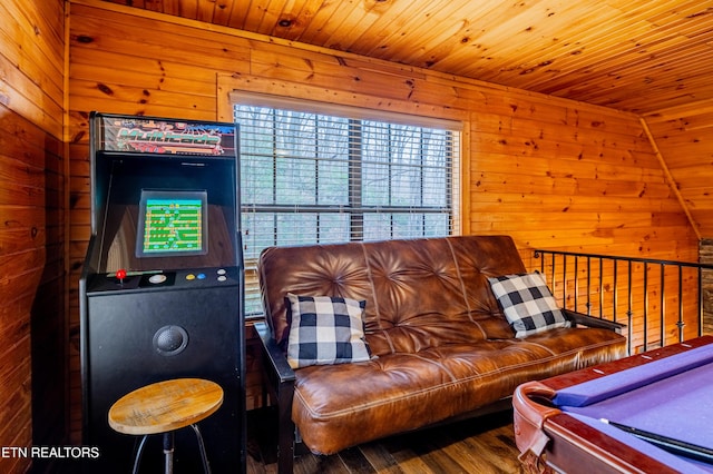 living room featuring wood-type flooring, billiards, wooden ceiling, and wood walls