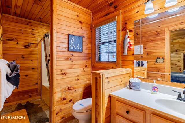 full bathroom with wood ceiling, vanity, wooden walls, hardwood / wood-style flooring, and toilet