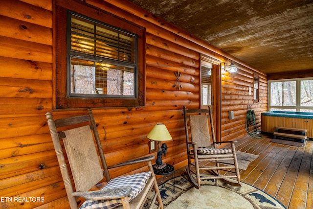 interior space featuring a porch and a hot tub