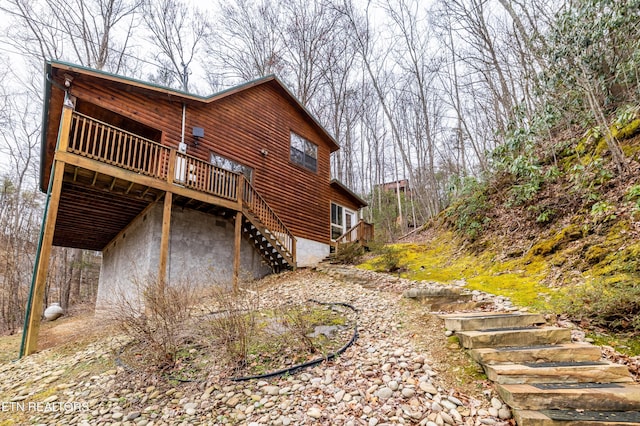 view of home's exterior featuring a wooden deck