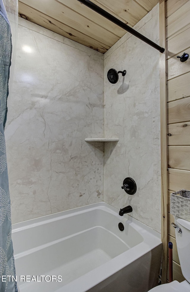 bathroom with toilet, shower / tub combo with curtain, and wooden ceiling