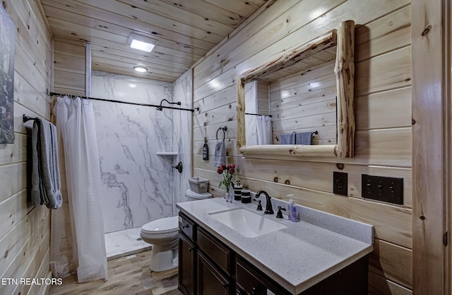 bathroom featuring toilet, vanity, hardwood / wood-style floors, a shower with curtain, and wooden ceiling