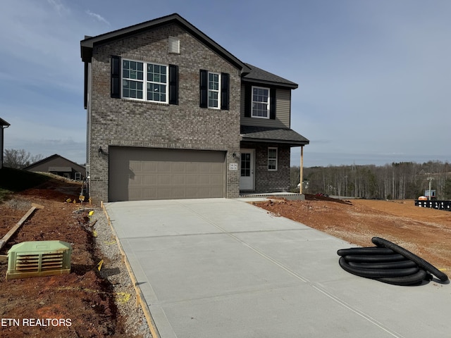 traditional home with brick siding, concrete driveway, a garage, and a shingled roof