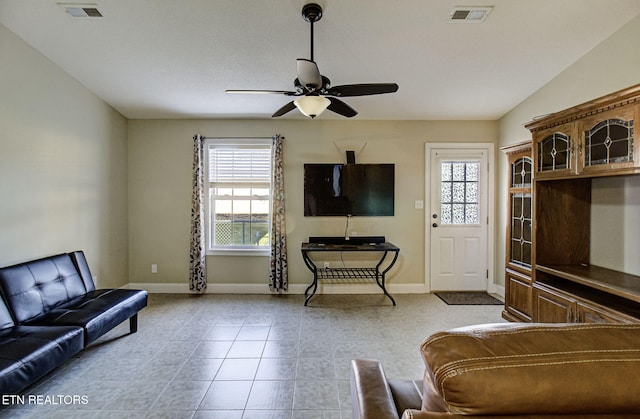 interior space featuring ceiling fan, light tile patterned floors, a wealth of natural light, and vaulted ceiling