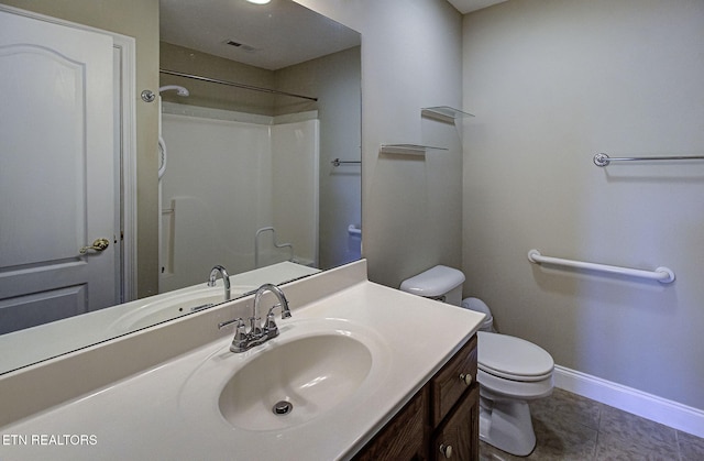 bathroom with tile patterned flooring, a shower, vanity, and toilet