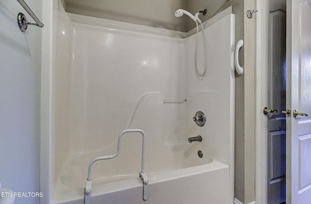 bathroom with shower / washtub combination